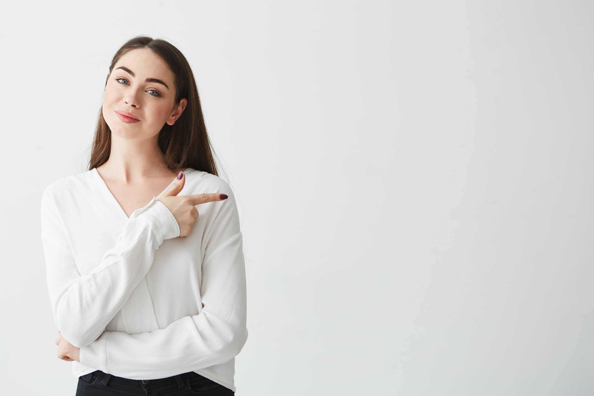 Woman in White Pointing